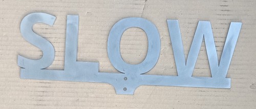Slow sign for - 1/4", or