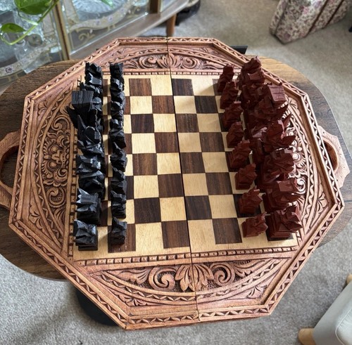 Hand carved wooden chess set - hand,