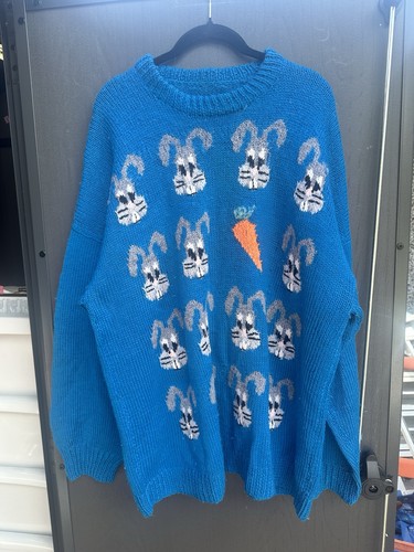Hand knitted rabbit and - hand,
