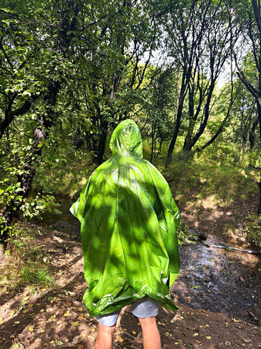 Green hooded plastic rain - hooded,