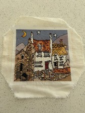 A Completed Cross Stitch On Aida