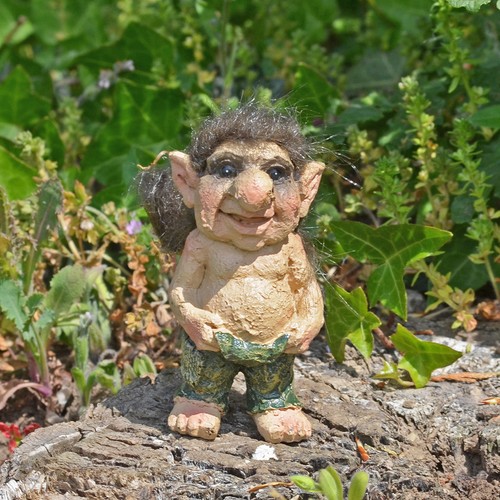 Troll holding pants sculpture - holding,