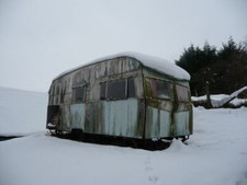 Photo 6x4 Old caravan above