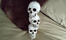 Stacking skulls head candle holder great quality with black candle that bleeds 