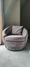 Dark grey velvet swivel armchair