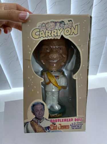 Carry bobblehead doll sid - on,