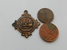 A MEDAL/FOB, FROM B.F.S.S. NELSON CENTENARY, CONTAINING VICTORY COPPER. 1905.
