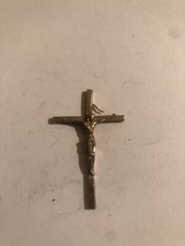 Old vintage pendant Jesus Christ being crucified on a cross 