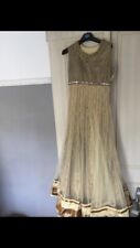 Long net dress With many Layers Underneath.Size Small .Colour Champion Gold.