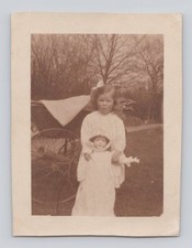 Old photo girl with pram - b&w,
