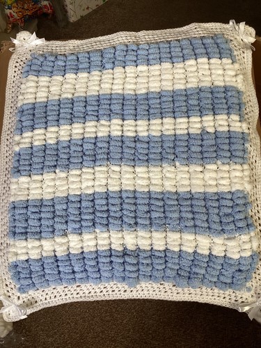 Hand knitted baby - hand, pompom