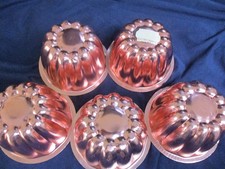 Vintage set of 5 copper coloured aluminium individual fluted jelly moulds