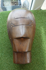 A HEAVY DARK WOOD BRASS