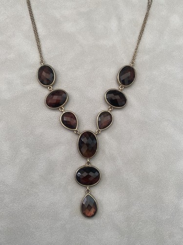 Goldtone and brown - and,