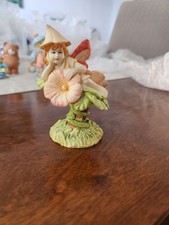 Ornament. Fairy Sitting On a