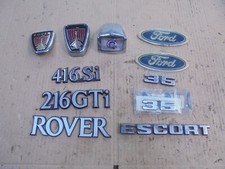 SELECTION OF FORD AND ROVER LOGO BADGES