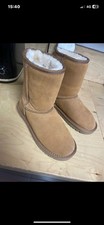 UGG Koola Short boots in a tan or chestnut suede with a faux-fur lining.