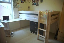 Space saving single raised bed frame with drawers, shelves and desk