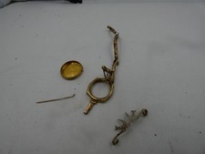 7.4 GRMS ,9 CRT YELLOW GOLD, LADIES WATCH CASE ,BROOCH SCRAP..