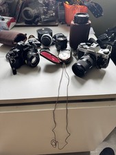 Canon A-1 And Ae-1 Vintage Cameras Plus Lens And Extras
