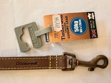 brown leather yellow stitching