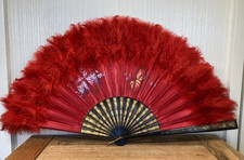 Vintage red and black folding hand fan with hand painted detail feather edging