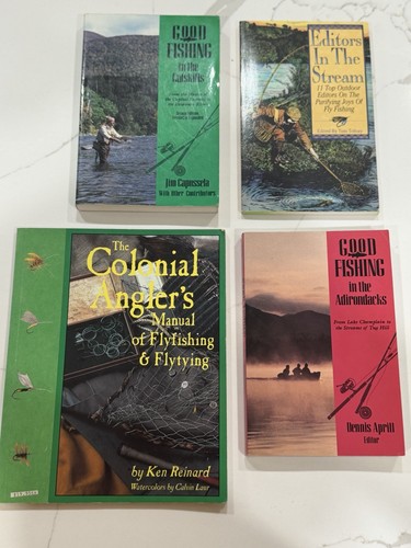 Four different books centered - four,