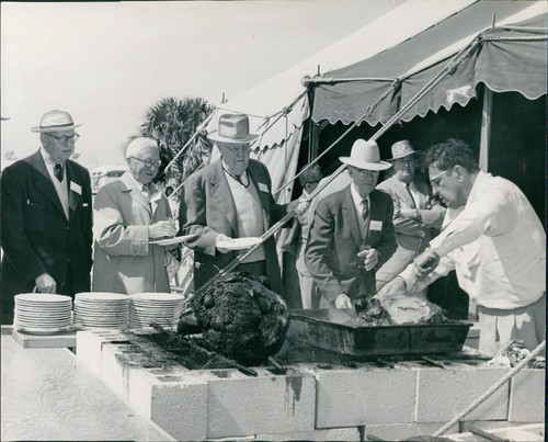 1958 photo men event - men, roasting