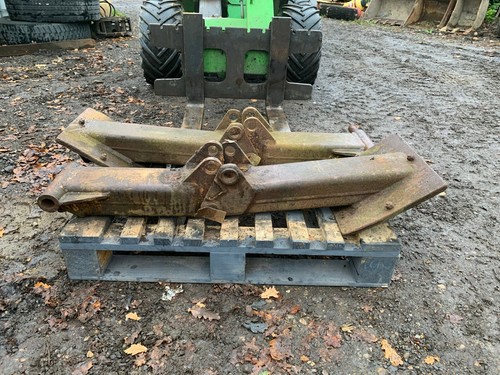 Pair backhoe stability - of, legs