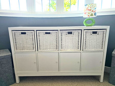 White Ikea Kallax Unit 2 x 4 with cupboards and baskets and stand