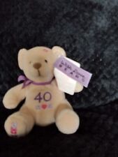 soft teddy bear with beads as stuffing has number 40 on the front of the bear