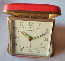 A Vintage 70s travel clock by Seiko with glow in the dark hands and numbers