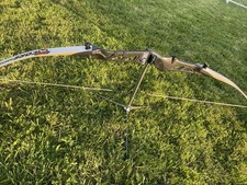 This Is A Beautiful Recurve Bow With A Matte Black Couloir To The Handle Part.