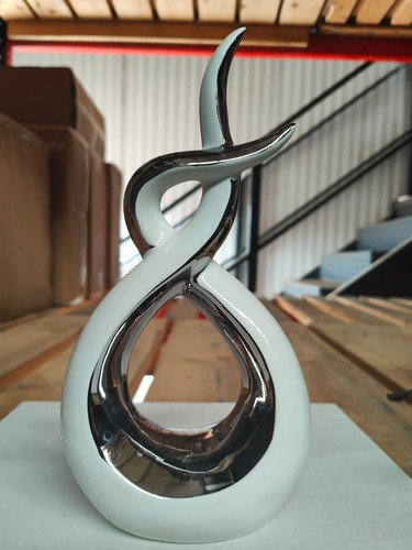 White silver swirl sculpture - silver,