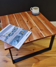 Unique small handmade coffee table with  distressed wood top on metal frame