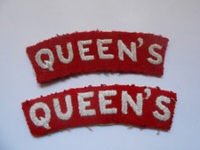 two    QUEEN`S   cloth shoulder titles which have been blanko`ed