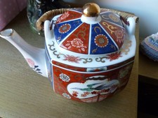 Vintage Gilded Imari Bamboo handle Tea Pot. 7.5”x 6”.Stamped Imari Japan in gold