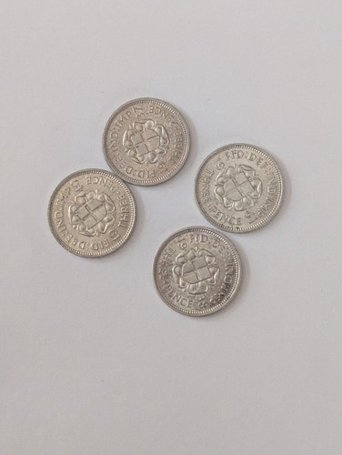 Four silver threepence - four,