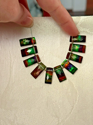 Faceted ammolite gemstones - faceted, –