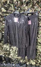 Brand new tags on black sequin