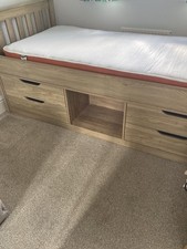 Single oak finish bed with storage underneath & mattress