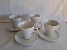 4 Coffee Mugs And Saucers