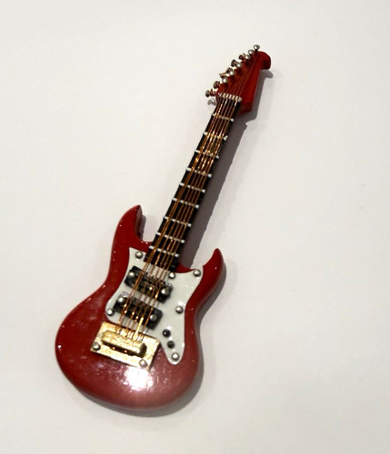 Miniature red guitar in - miniature,