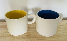 A Pair Of Futon Company Mugs Blue Yellow