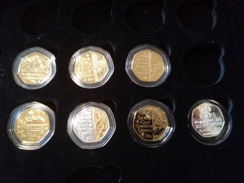 Seven commemorative pence - seven,