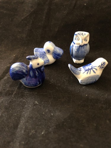 Four white and blue miniature