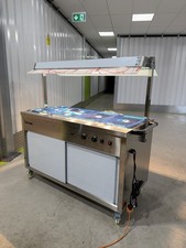 Hot cupboard with heated