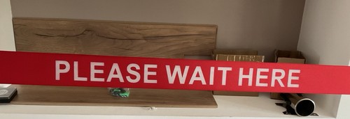 Please wait here - -, retractable