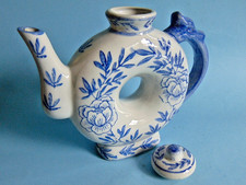 Vintage 7" tall doughnut shaped blue and white oriental teapot. Made in China