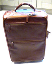 Premium tanned leather Ashwood airline pull along cabin bag on trolley wheels.